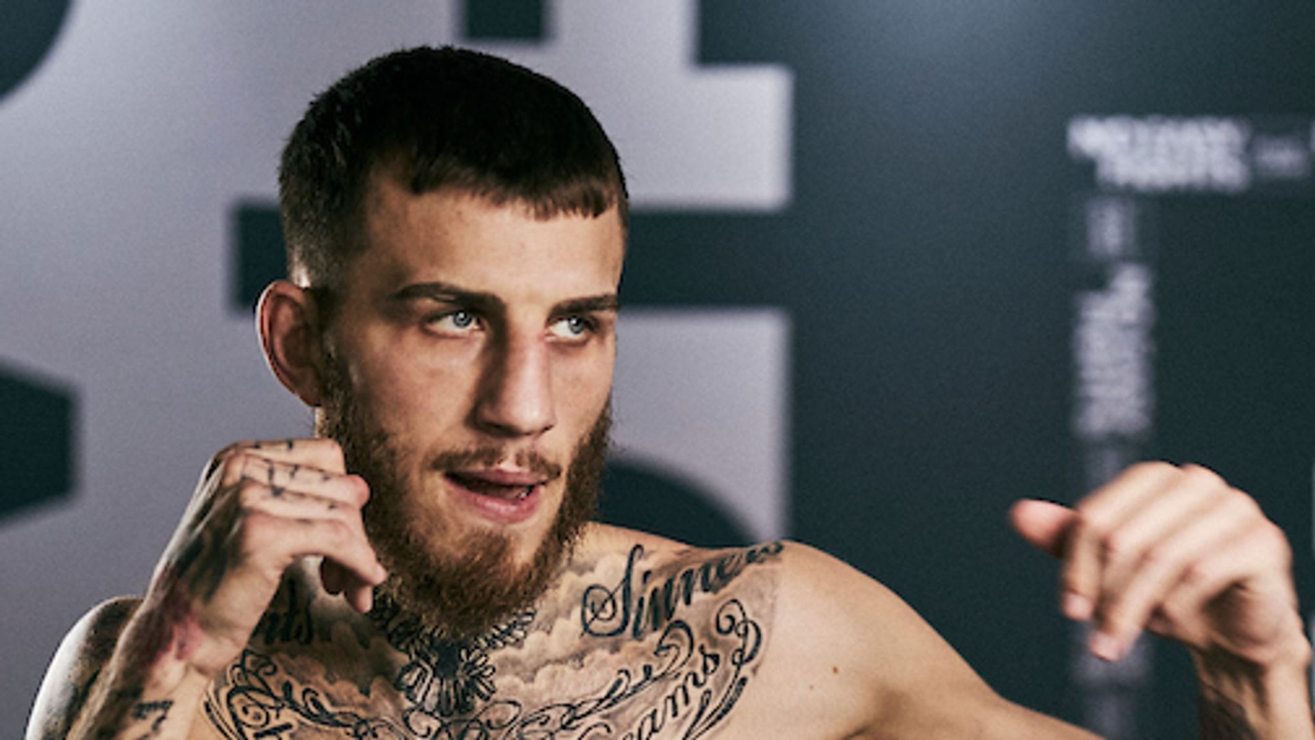 Sam Eggington in a press shot, looking toward the camera